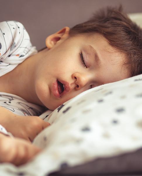 young boy snoring while asleep