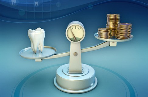 Tooth and coins on a balance scale