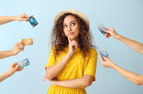 Woman surrounded by credit cards