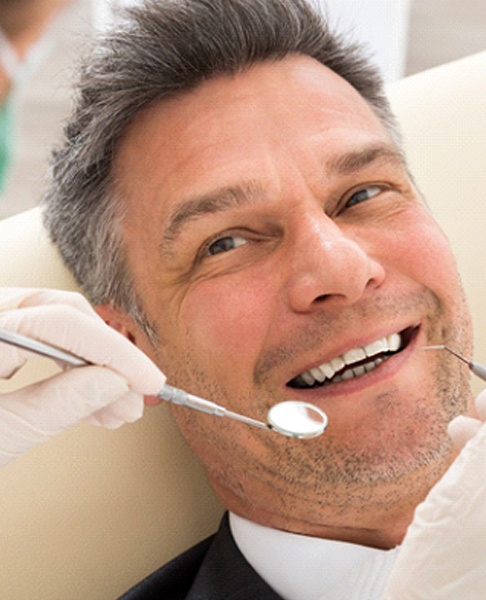 Patient at dentist in Collegeville for dental crowns
