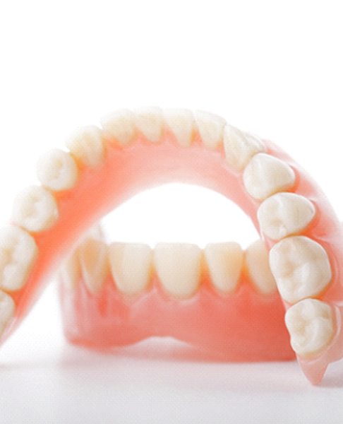 A full set of dentures designed for a person with missing teeth on the top and bottom arches