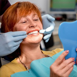 patient getting dentures in Collegeville