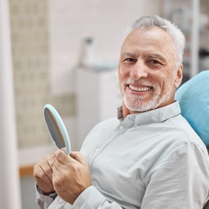 Man smiling after visiting emergency dentist in Collegeville