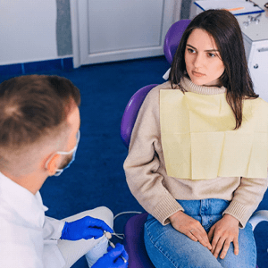 Patient and dentist having a serious conversation