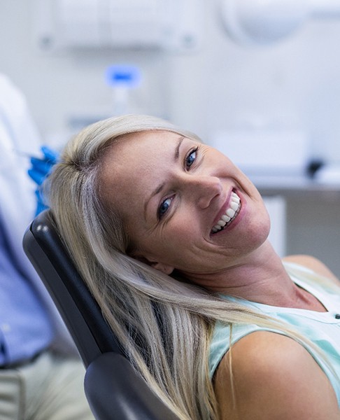 Woman talking to dentist in Collegeville