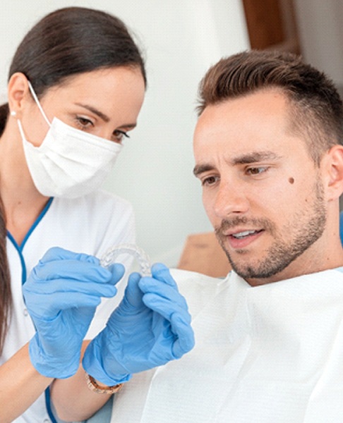 dentist explaining Invisalign in Collegeville