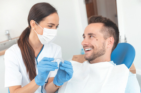 Dentist discussing Invisalign in Collegeville 