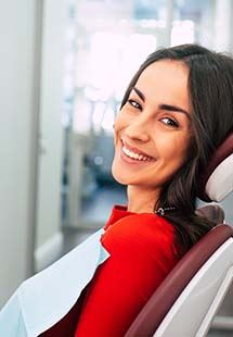 woman smiling seated in dental chair in Trappe