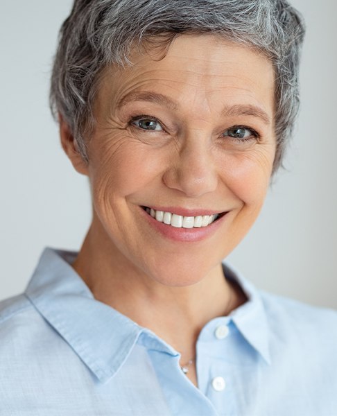Woman with dentures sharing smile