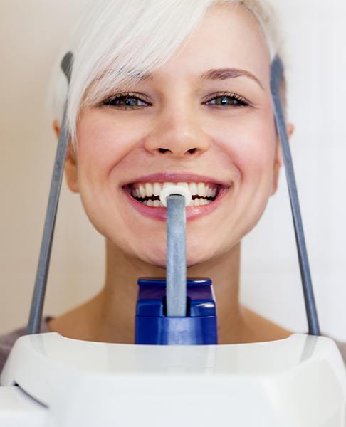 Woman receiving C T cone beam x-ray scan