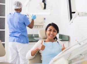 Happy patient giving thumbs up for dental checkup