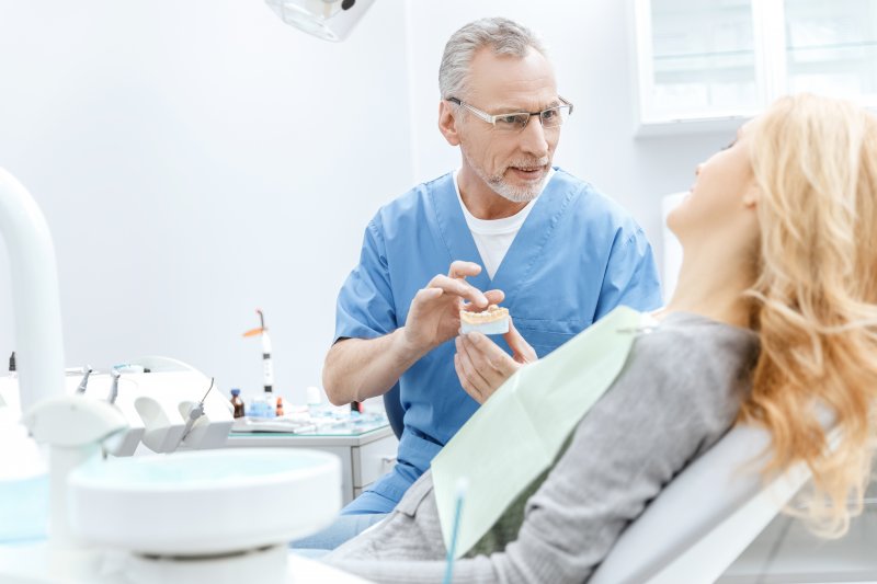 Emergency dentist explaining treatment to patient