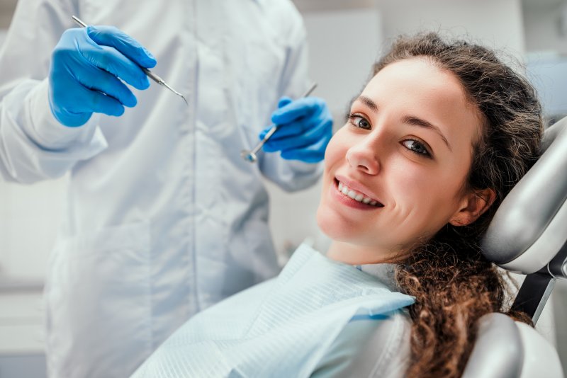 young woman smiling during dental checkup